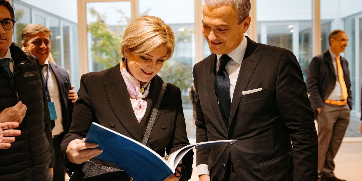 two people looking at a book together