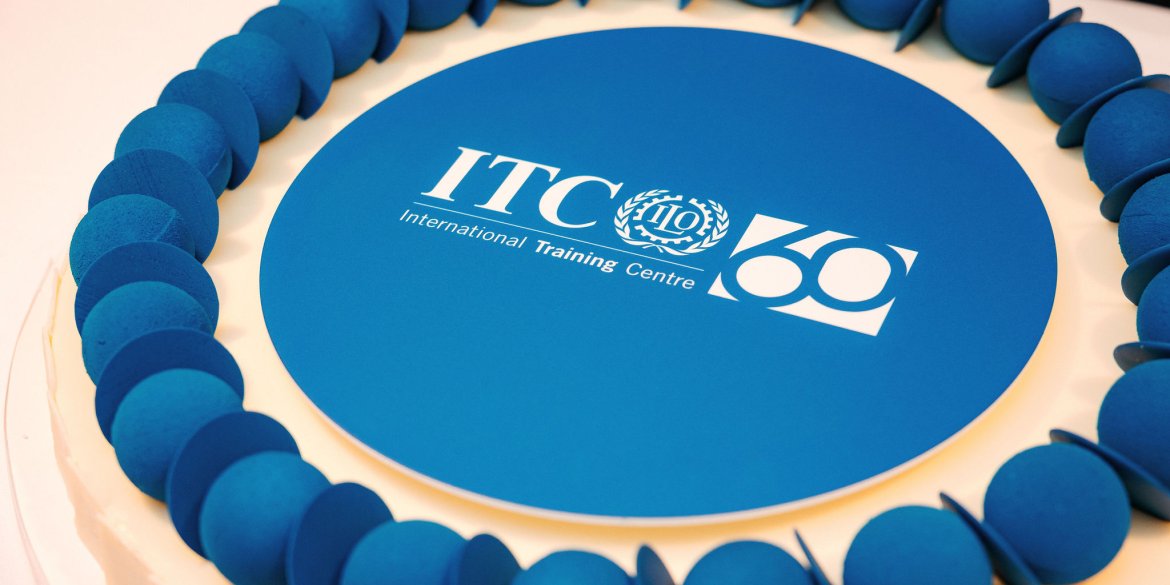 a cake with blue frosting and the itcilo logo