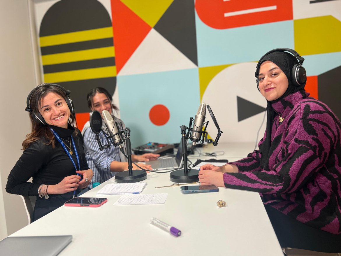 two women engaging in a podcast recording session