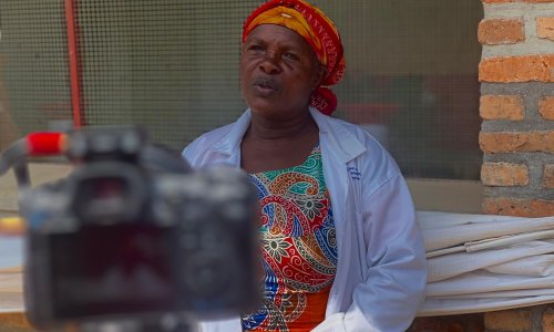 woman farmer in Rwanda being interviewed